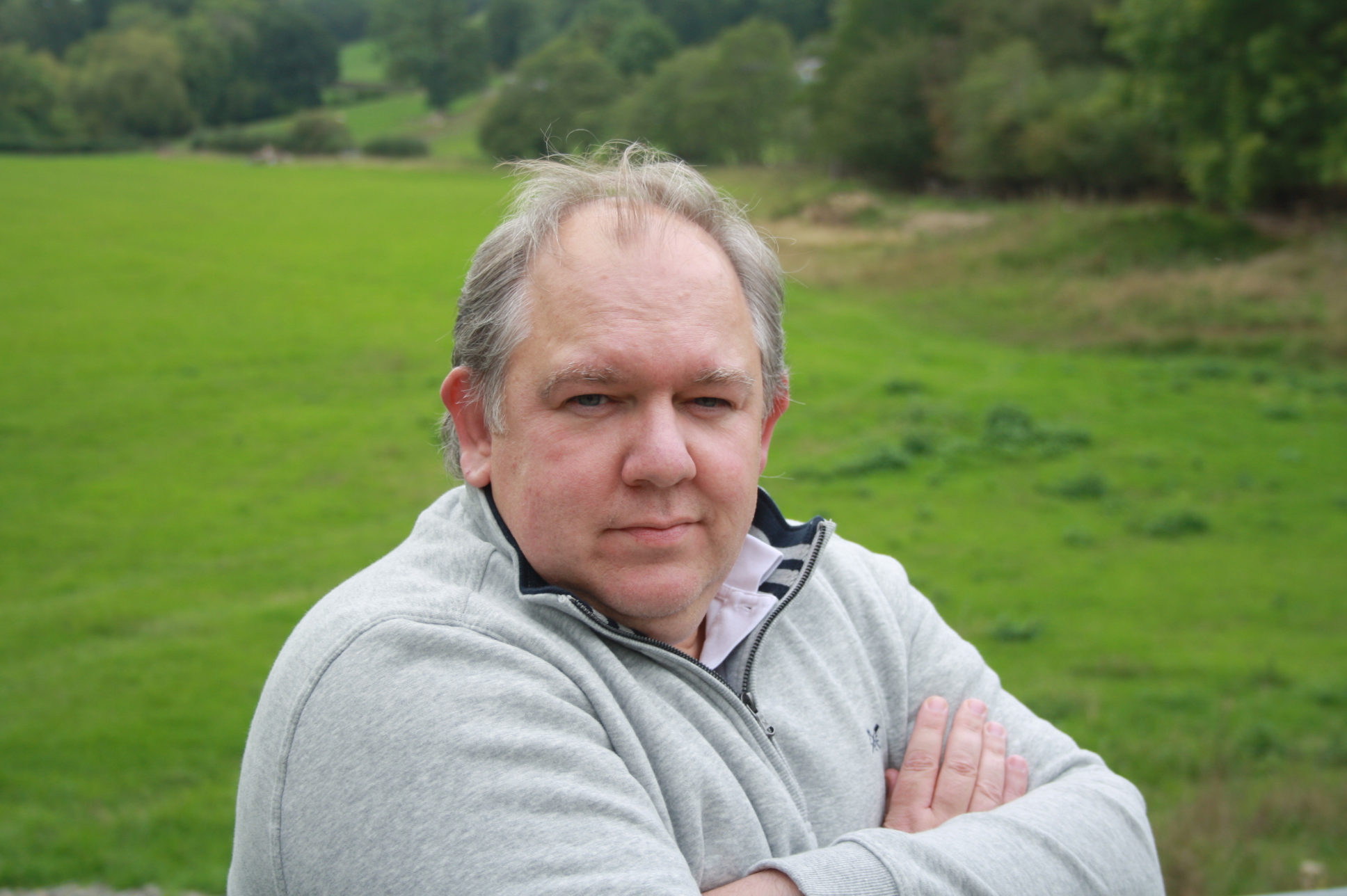 Duncan Whelan, psychotherapeutic counsellor sitting in a quiet, sunlit room